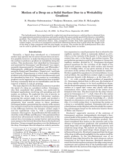 Motion of a Drop on a Solid Surface Due to a Wettability Gradient