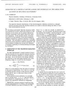 radiation of a particle moving across the interface of two