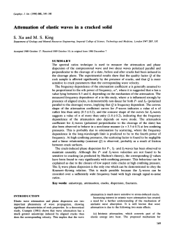 Attenuation of elastic waves in a cracked solid