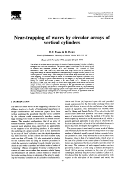 Near-trapping of waves by circular arrays of vertical cylinders