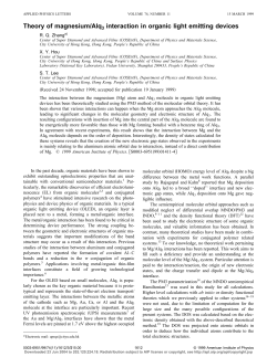 Theory of magnesium/Alq3 interaction in organic light emitting devices