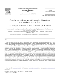 Coupled periodic waves with opposite dispersions in a nonlinear