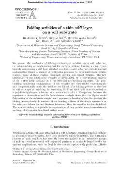 Folding wrinkles of a thin stiff layer on a soft substrate