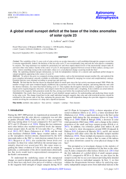 A global small sunspot deficit at the base of the index anomalies of