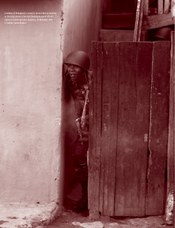 A member of Madagascar`s security forces takes up position as the