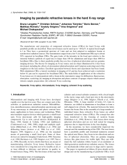 Imaging by parabolic refractive lenses in the hard X