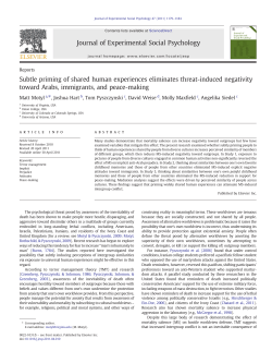 Subtle priming of shared human experiences eliminates threat